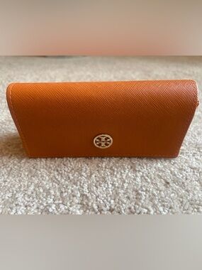 Tory Burch Orange Saffiano Leather Wallet with Gold Logo Accent.